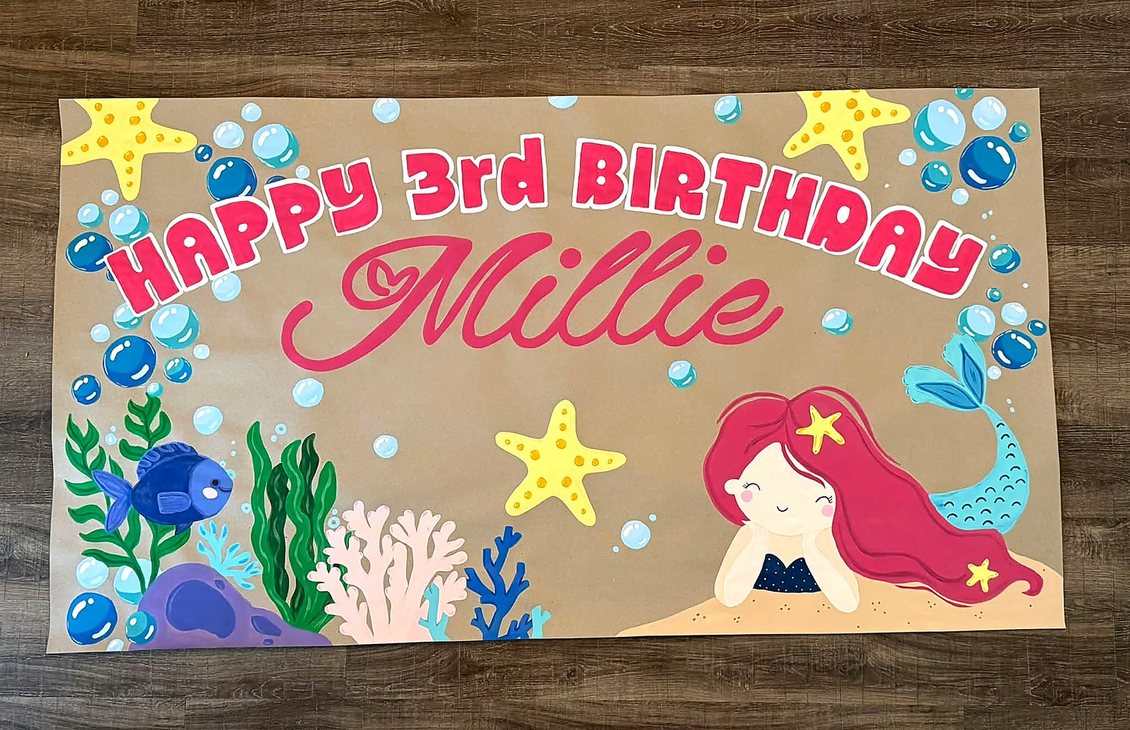 Hand-painted mermaid-themed third birthday banner with bubbles, starfish and ocean artwork